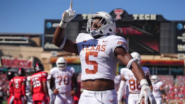 Texas Longhorns running back Bijan Robinson (5) celebrates after a touchdown against the Texas Tech Red Raiders.